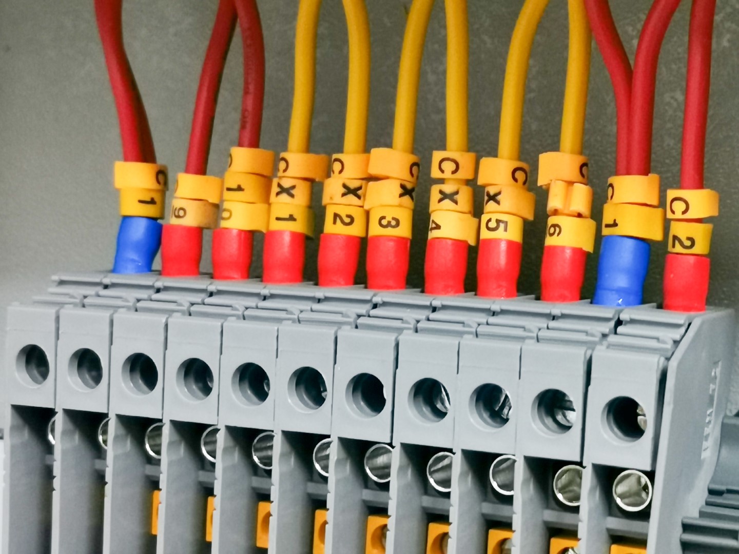 A row of terminal blocks in an electrical cabinet.