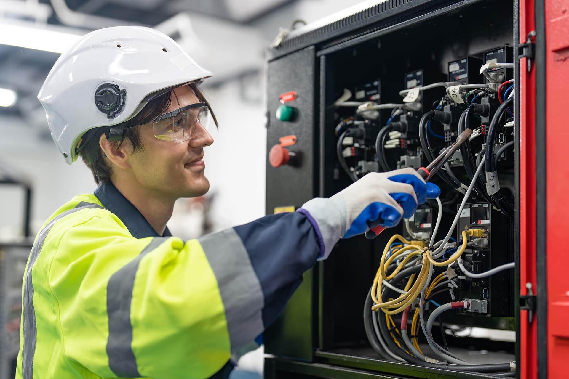 An electrician installs a wire cable.