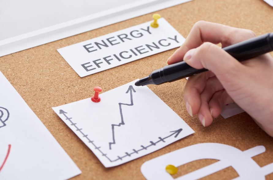 Cork board with the words “energy efficiency” next to a hand-drawn diagram.