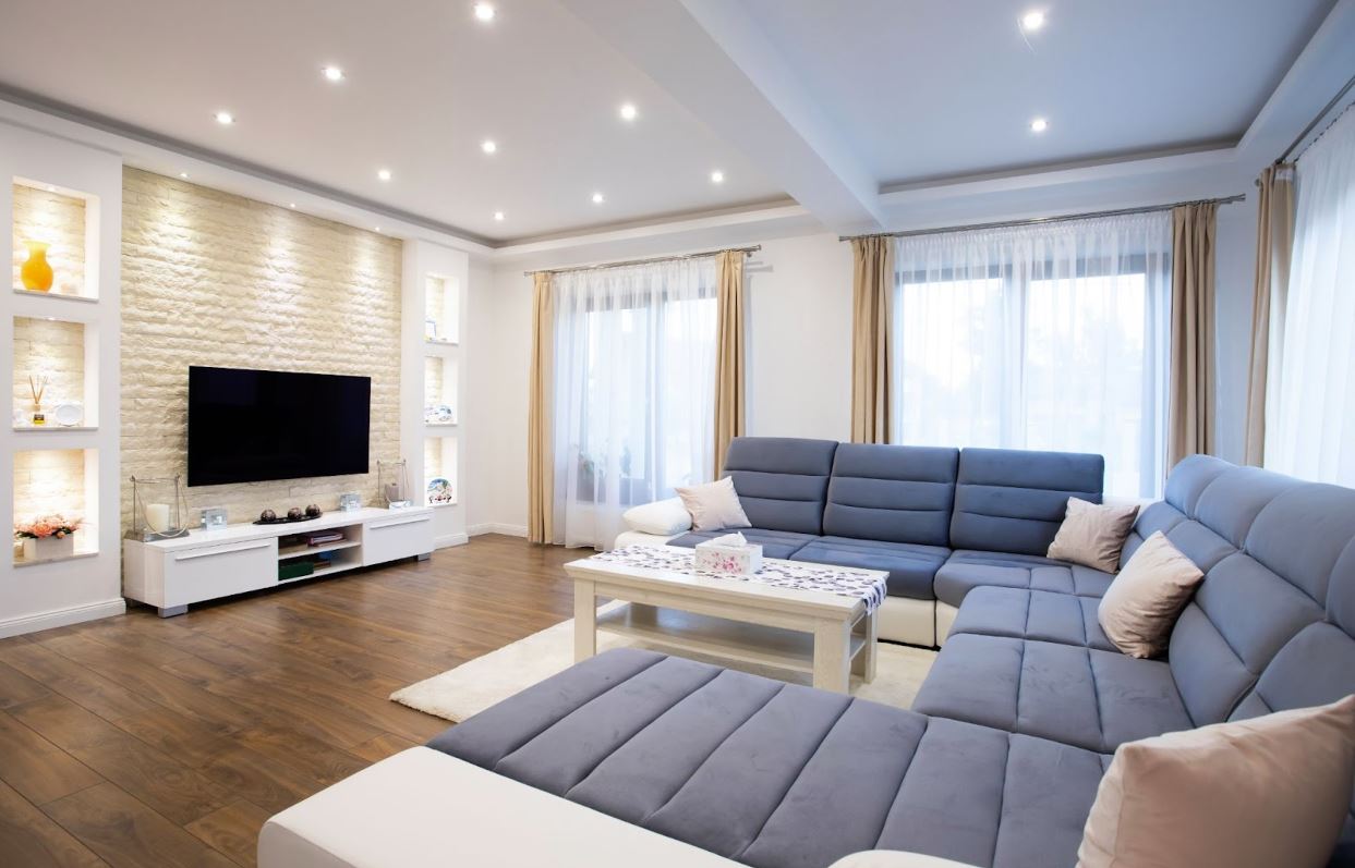 Living room with overhead LED lighting.